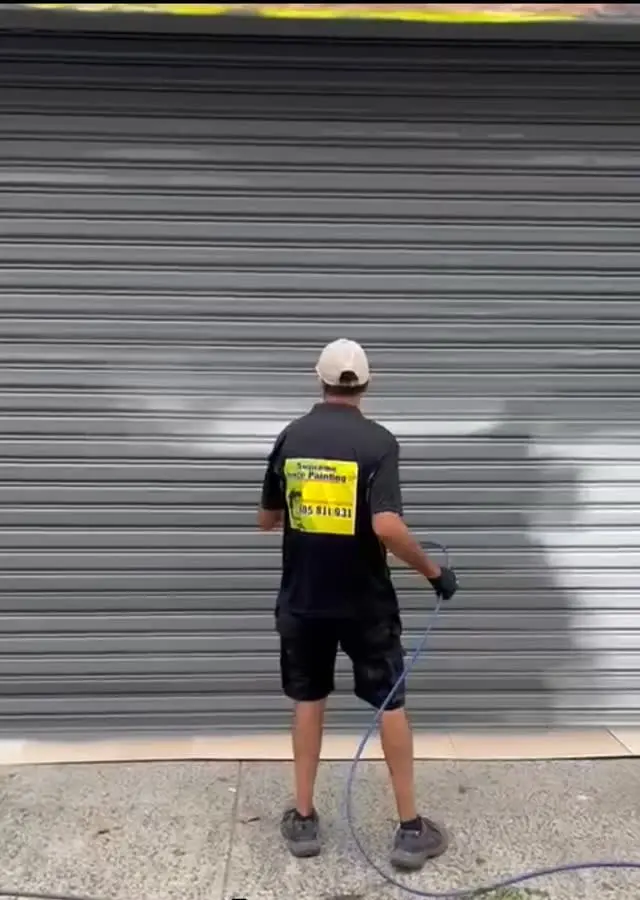 Rafael spray painting with the airless rig