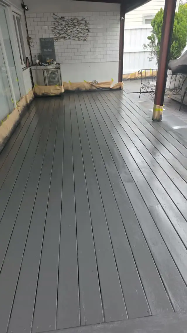 Freshly coated grey deck, masking still in place
